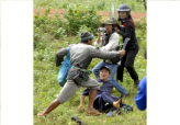Thai Villager Attacks Protesters as Police Watch                                                    